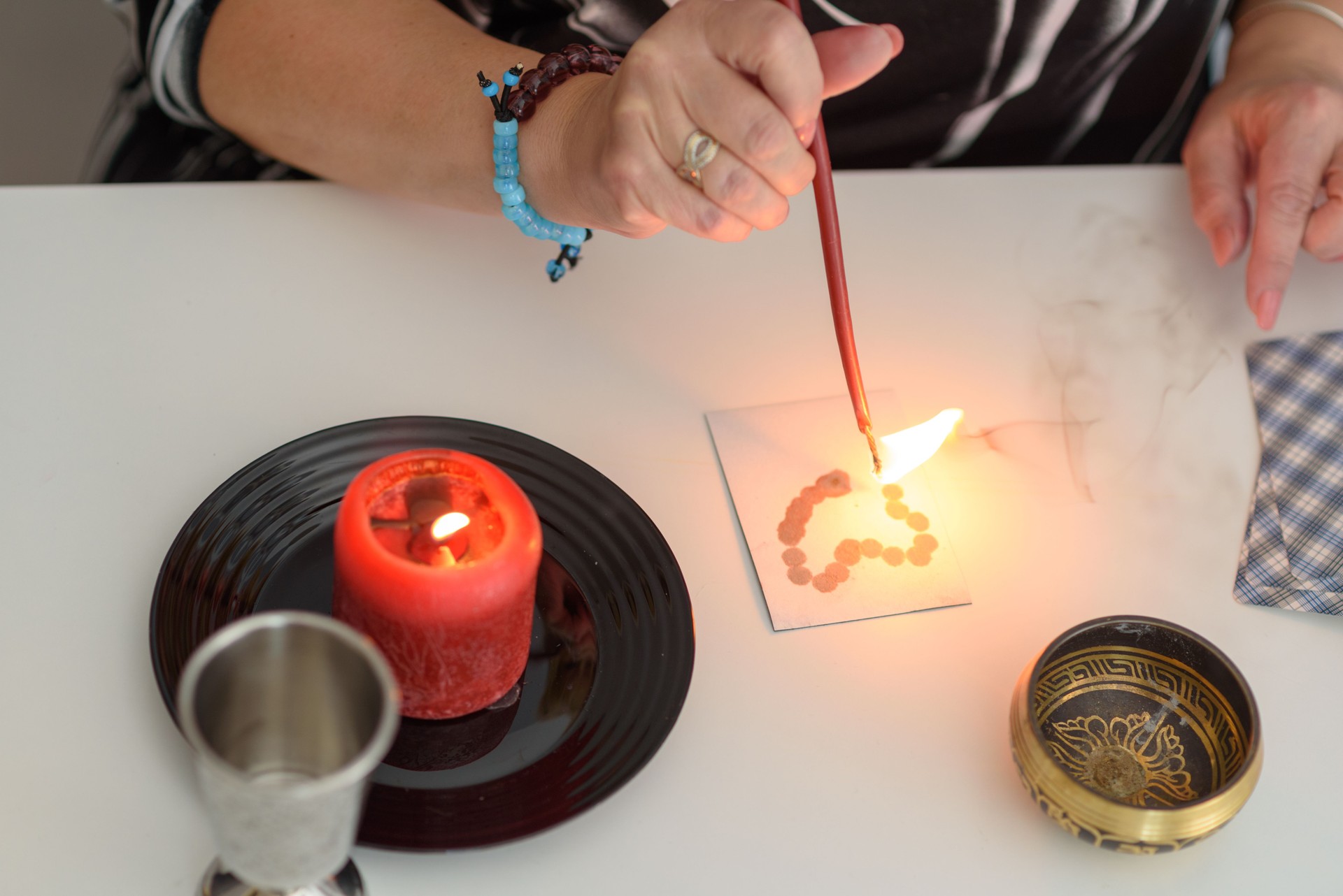 Close up of fortune teller woman hands make magic love spells