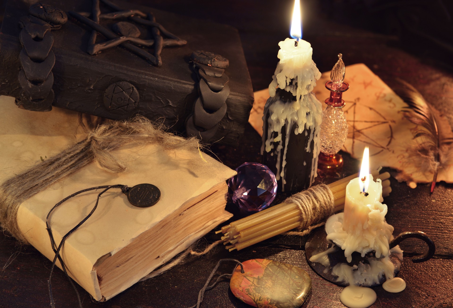 Still life with magic objects, books and candles