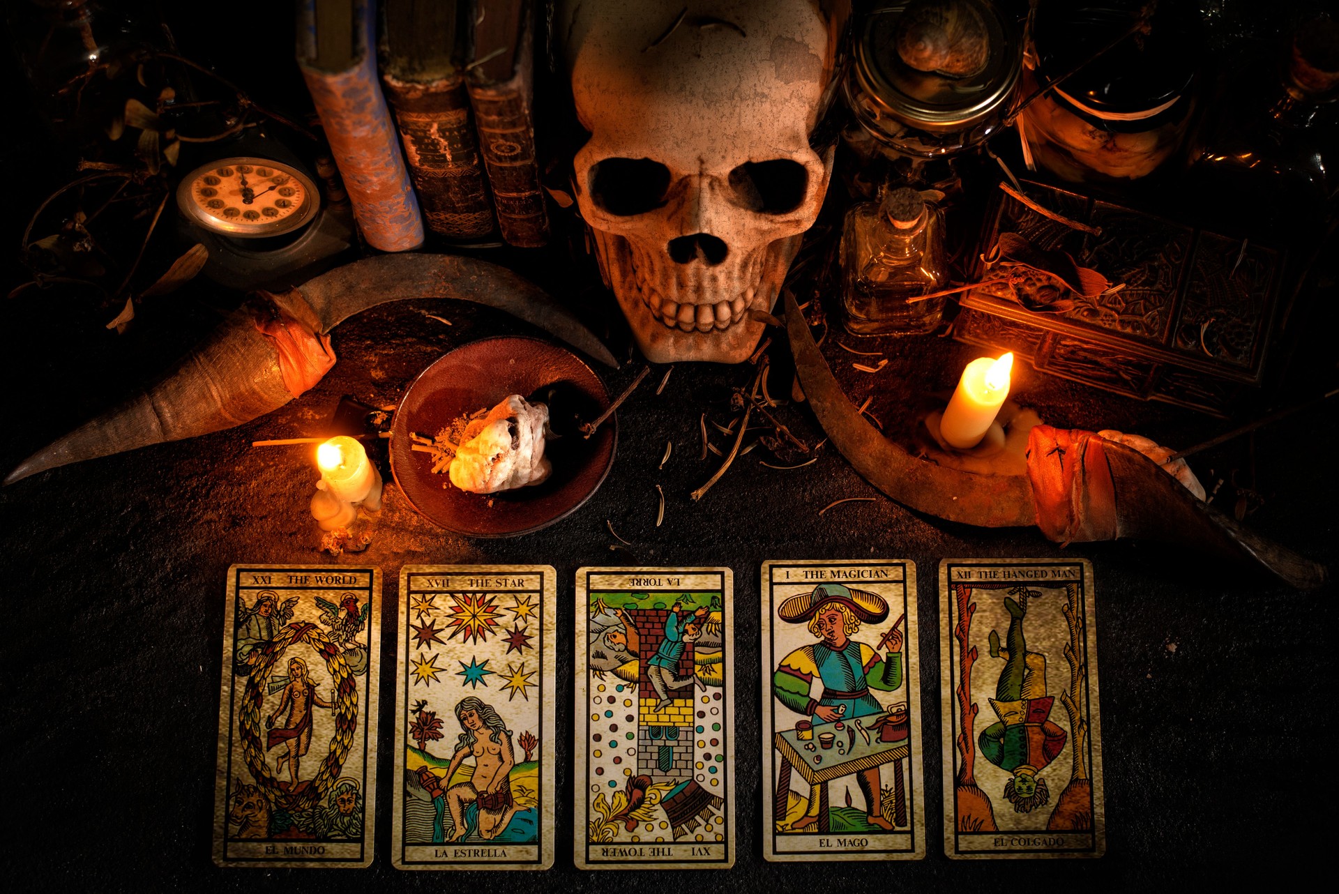 Tarot cards, skull and magic items.